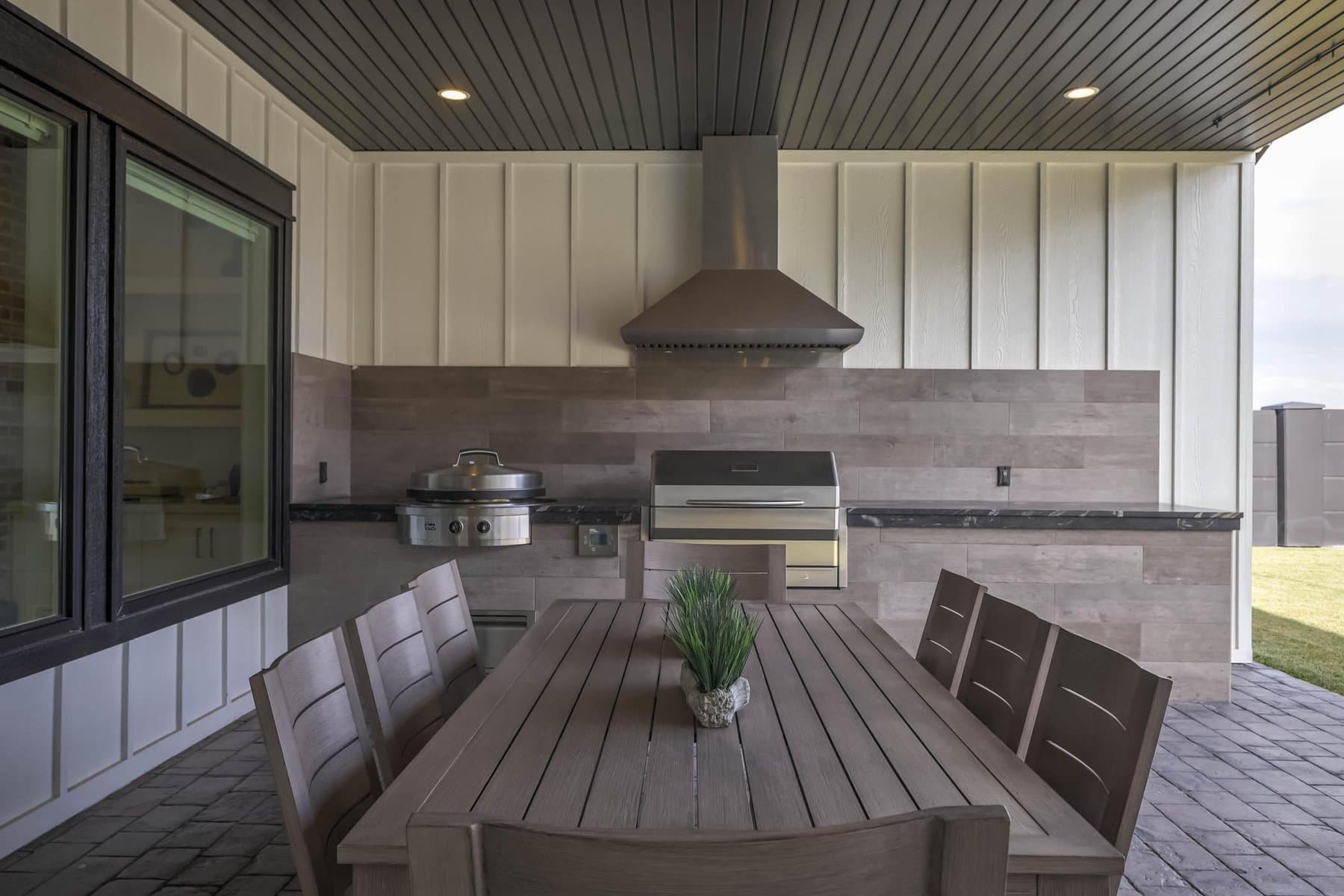 The covered outdoor kitchen and dining terrace