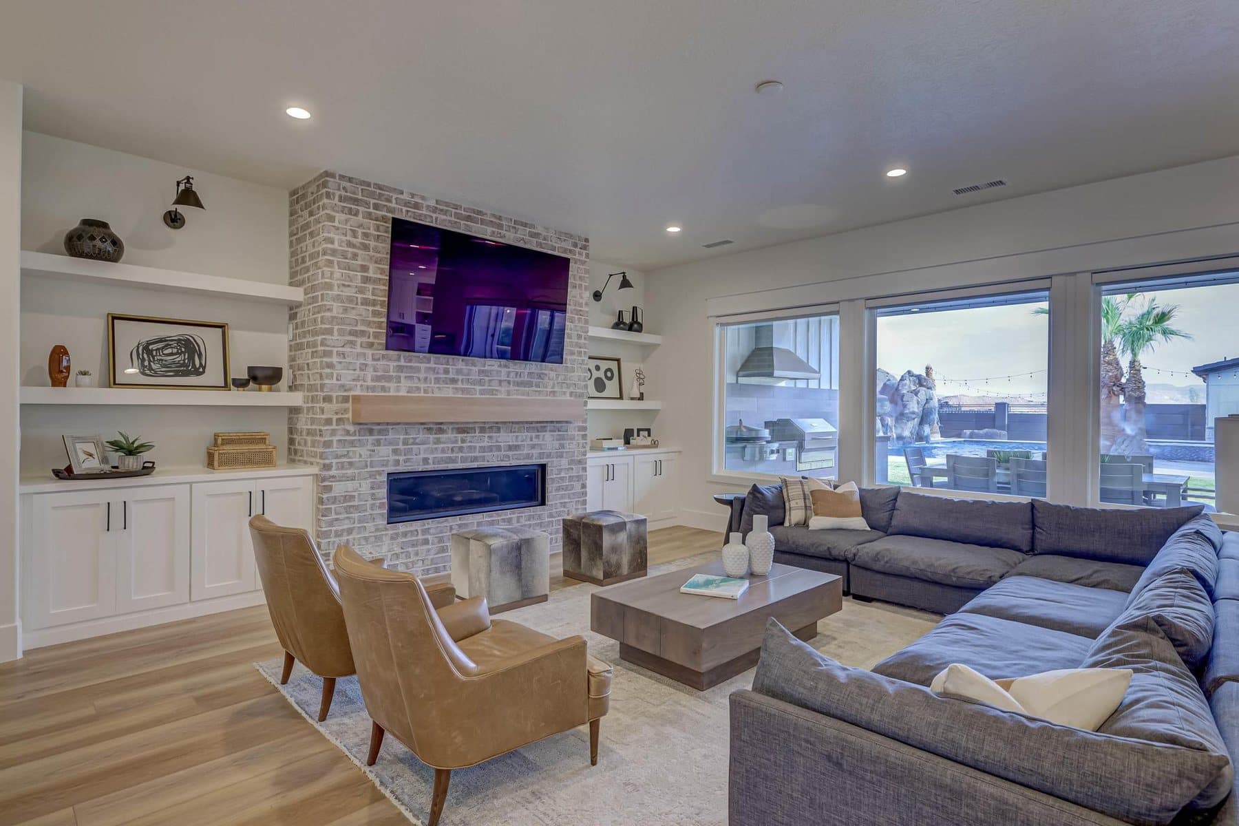 The great room, on a gas fireplace and open to the kitchen