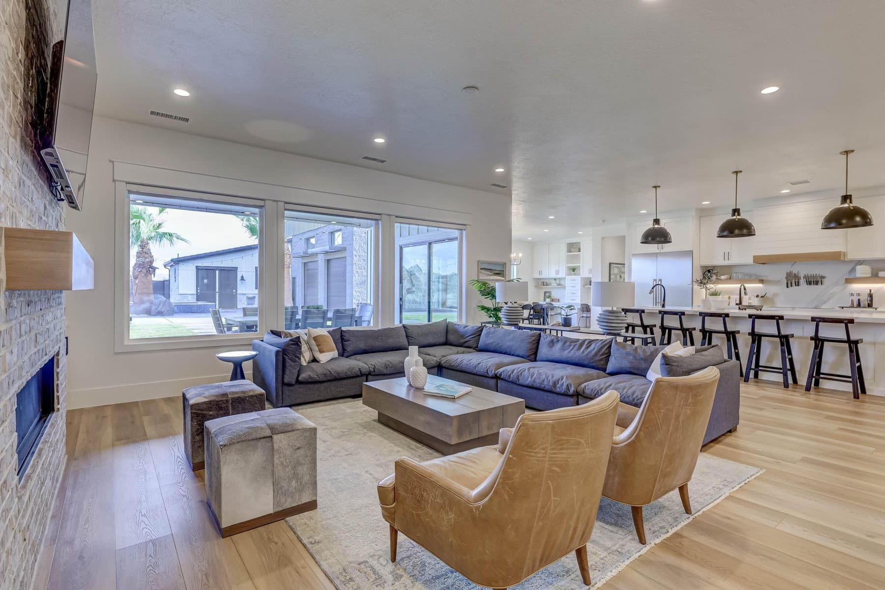 The great room, on a gas fireplace and open to the kitchen