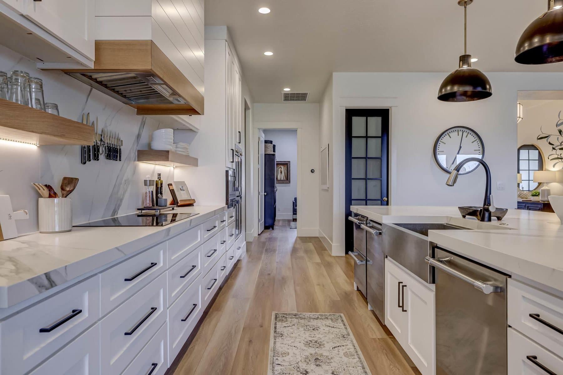 The kitchen — oversized quartz island, pendant lighting and bar seating