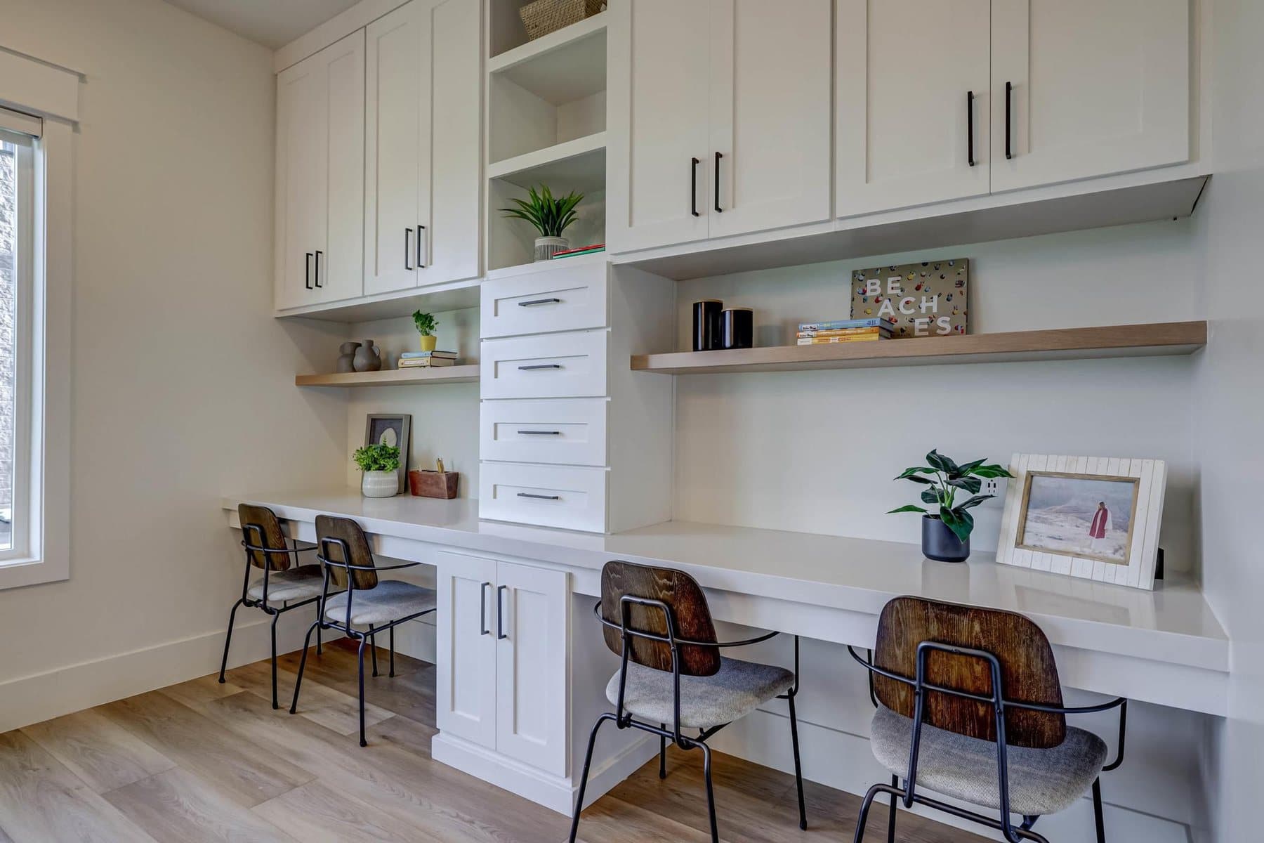 Built-in desks and cabinetry off the living space