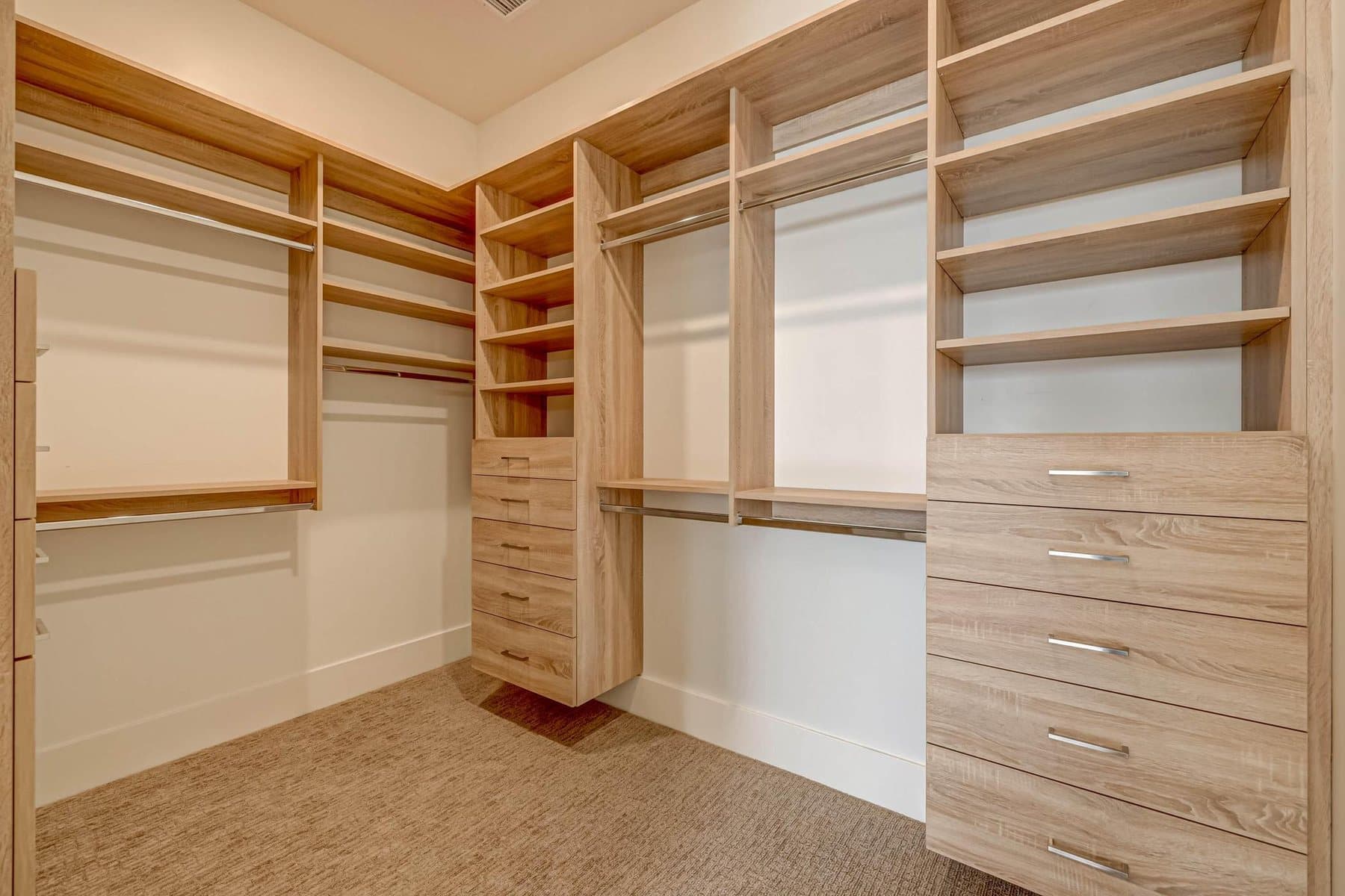 The walk-in closet with custom built shelving