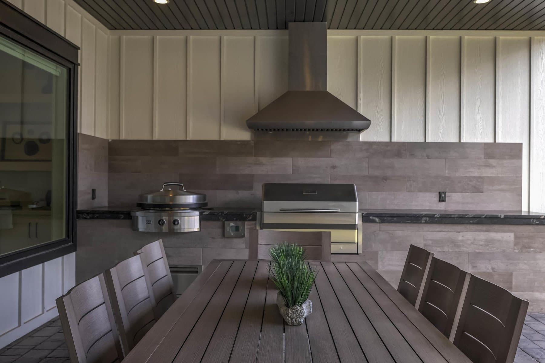The covered patio and outdoor BBQ kitchen