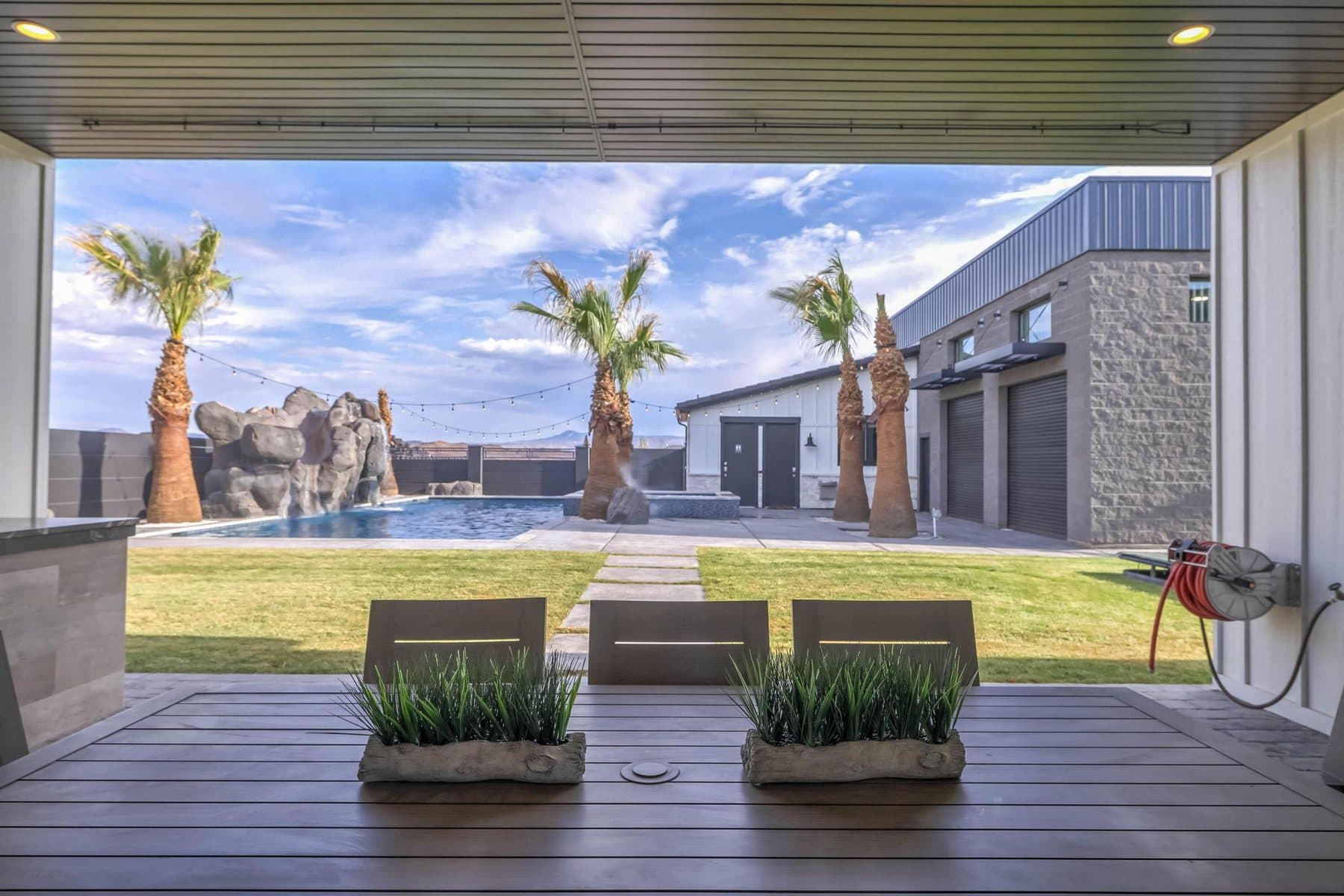 The covered patio and outdoor BBQ kitchen
