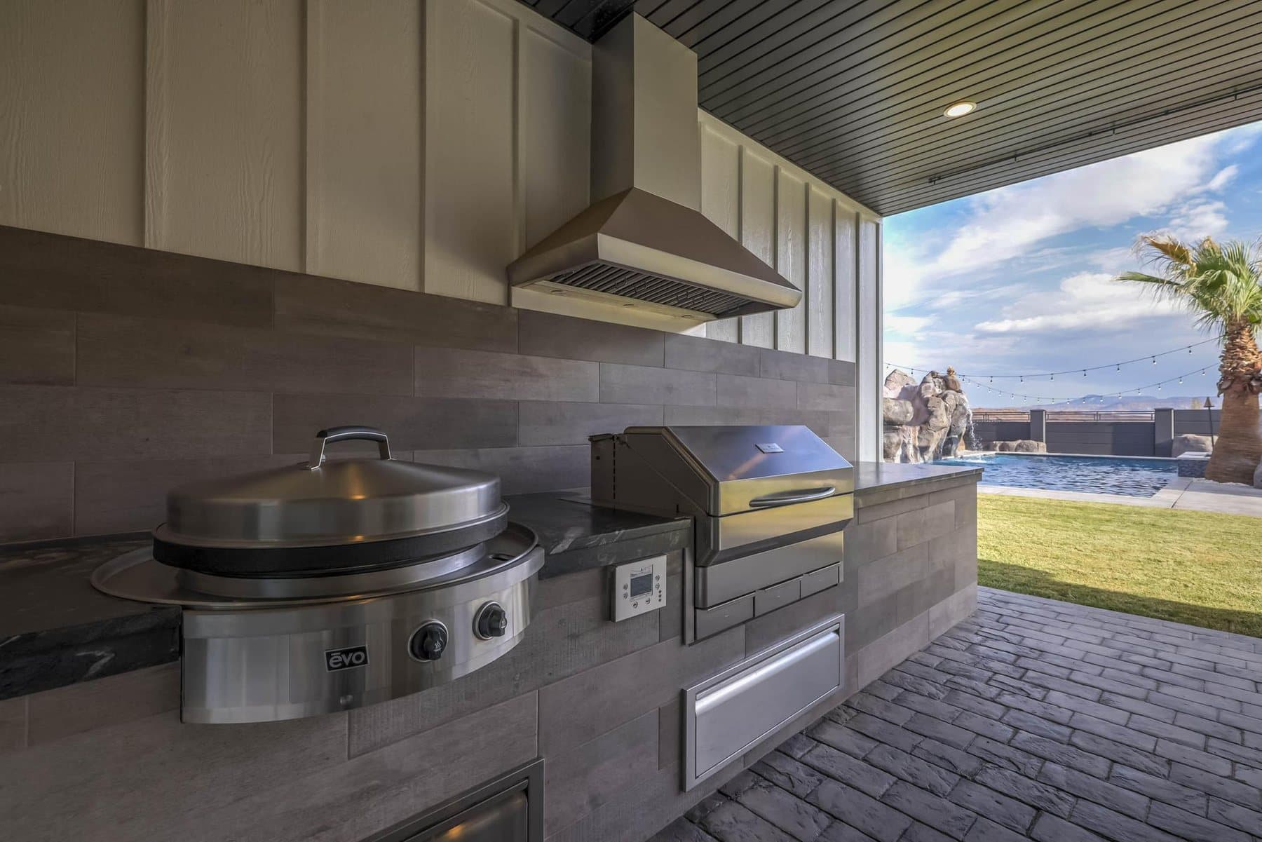 The covered patio and outdoor BBQ kitchen