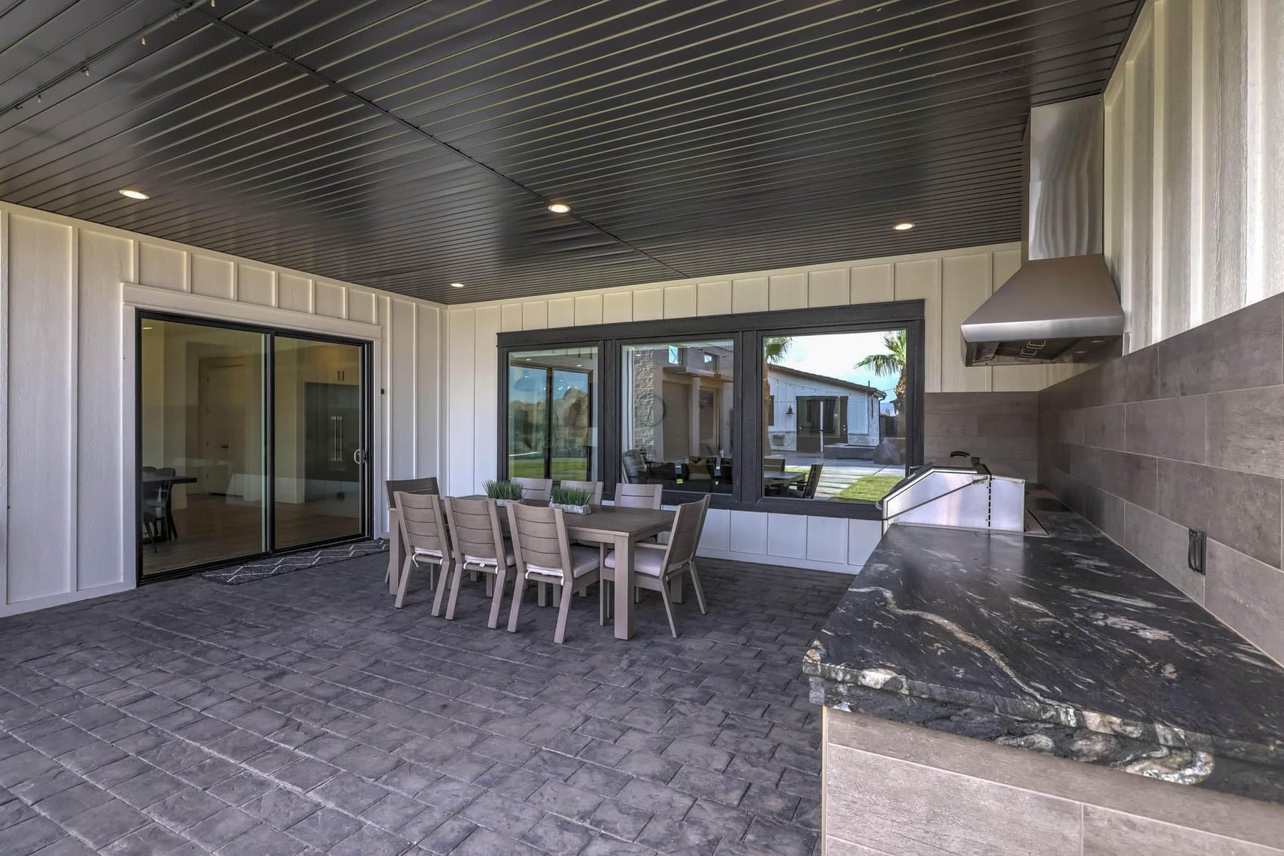 The covered patio and outdoor BBQ kitchen