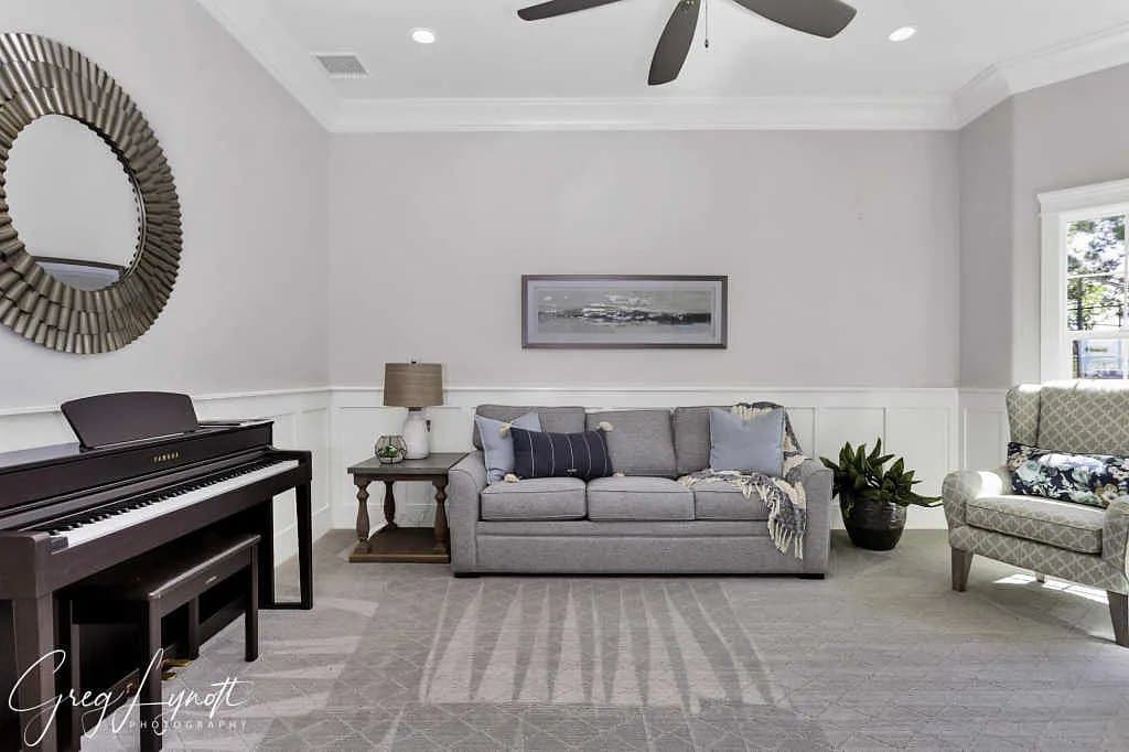 The living room, piano against the window wall