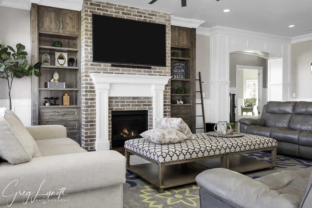 The great room on its brick fireplace